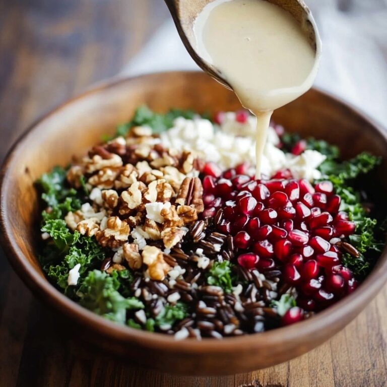 Vibrant Pomegranate, Kale, and Wild Rice Salad with Walnuts and Feta Recipe